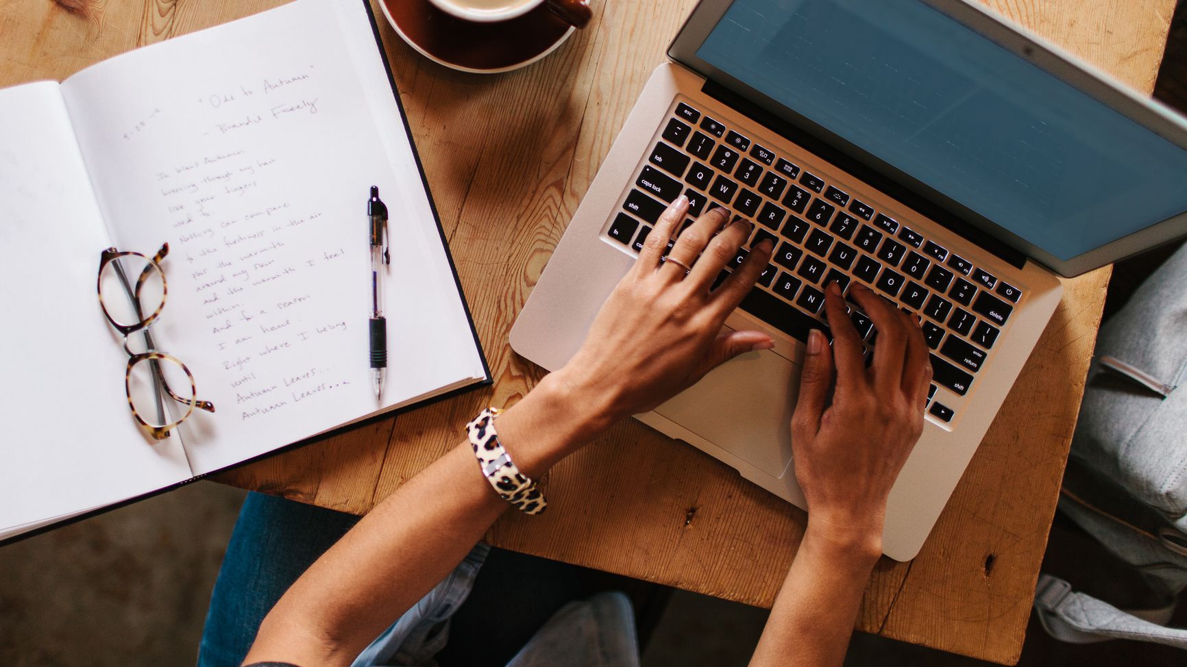 Image of a woman typing on a computer